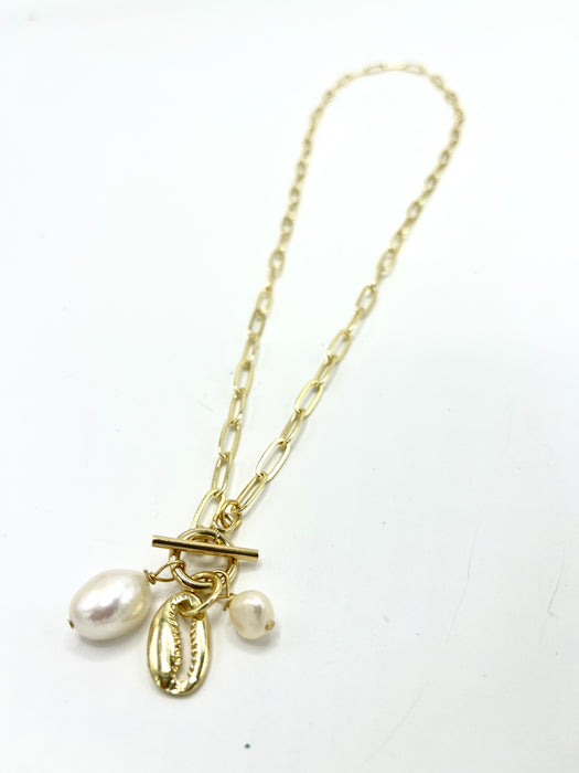 Gold Paperclip necklace with a gold fill conch, freshwater pearl and stone dangles.