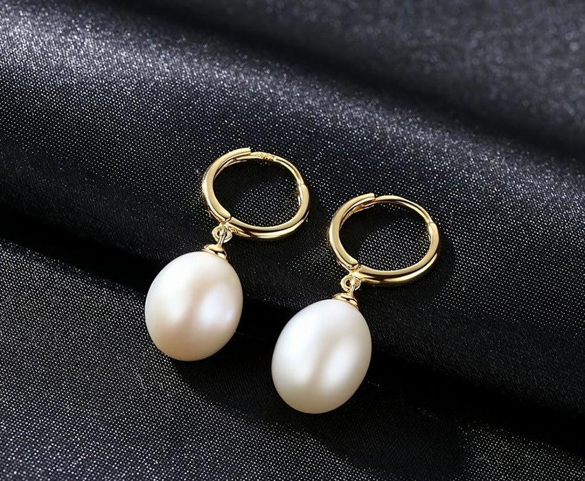 Gold plated sterling silver hoops with white pearl drops