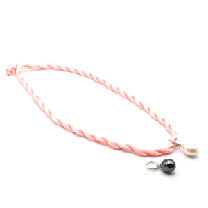 Freshwater pearl on coloured cord